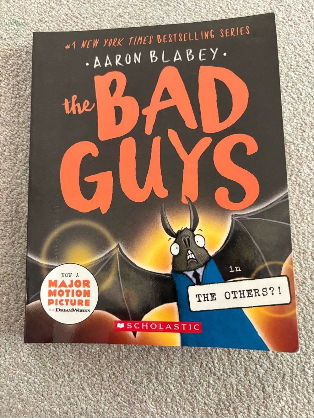 Scholastic The Bad Guys – Black & Orange Cover with Blue Character